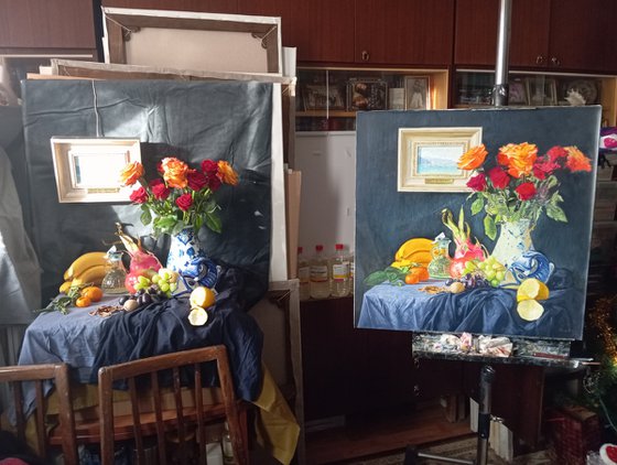 Roses in a ceramic vase and fruits