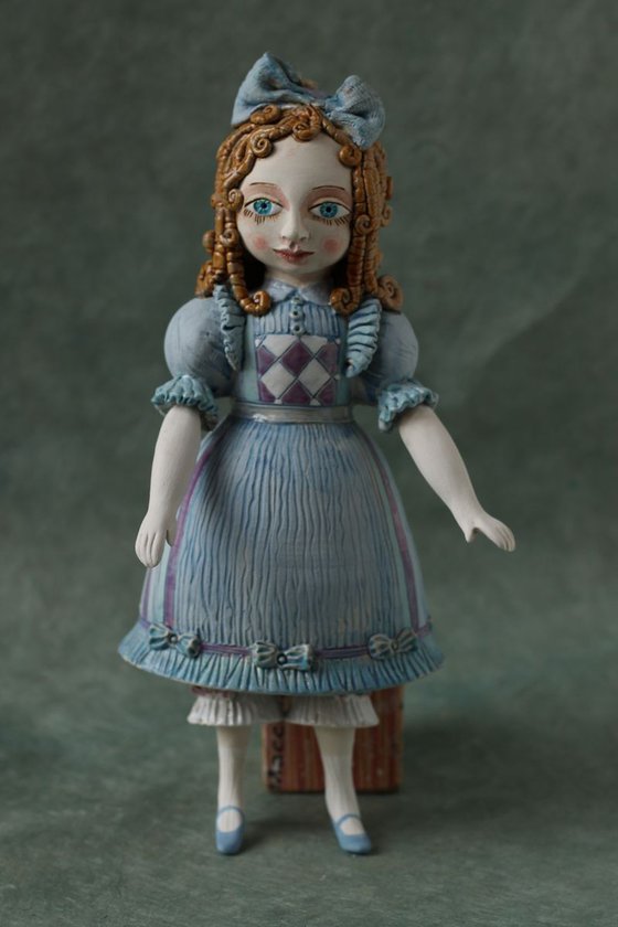 From the Alice in Wonderland. Alice as a little girl.  Wall sculpture by Elya Yalonetski