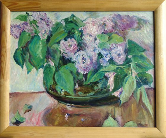 Lilacs in a pot-bellied vase.