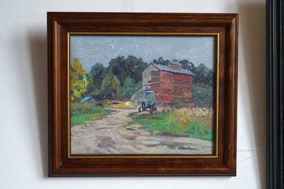 Blue tractor at the sawmill. Rodnya village