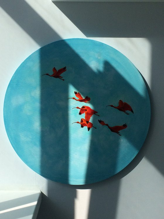 Round painting with flying red ibis and blue sky - The red thread