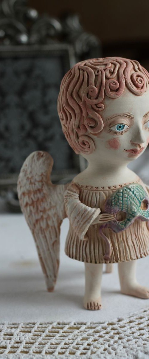 Angel holding a mask. Ceramic OOAK sculpture. by Elya Yalonetski