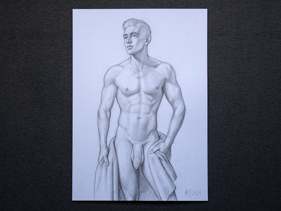 Nude young man with a towel