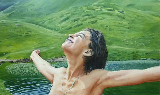Embracing the world - large mountain landscape with woman portrait after swimming in the highland lake