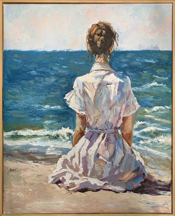 Woman by the ocean.