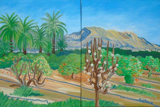 Puig Campana with palm trees and orange grove