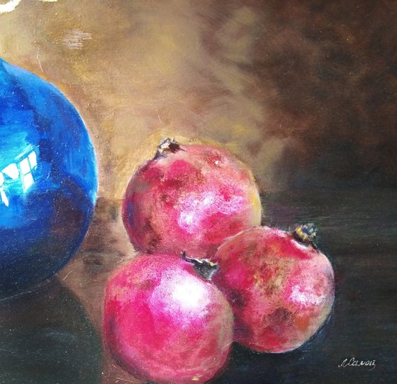 Still life with pomegranates and blue vase