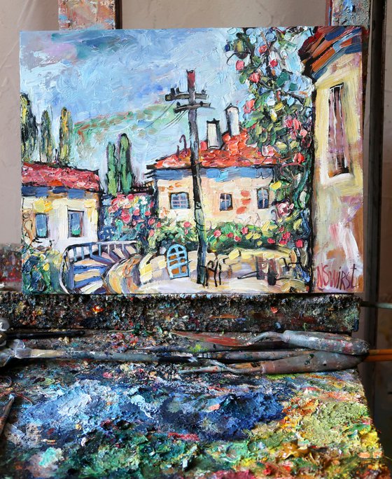 Street and rose bush.
