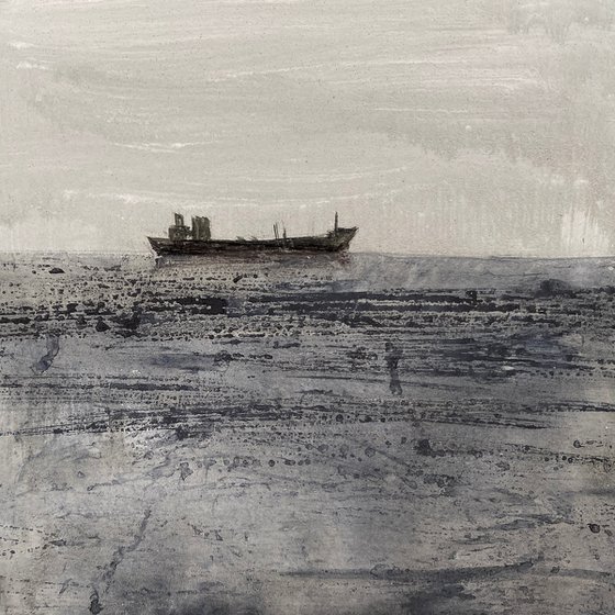 Grey day at sea lone boat