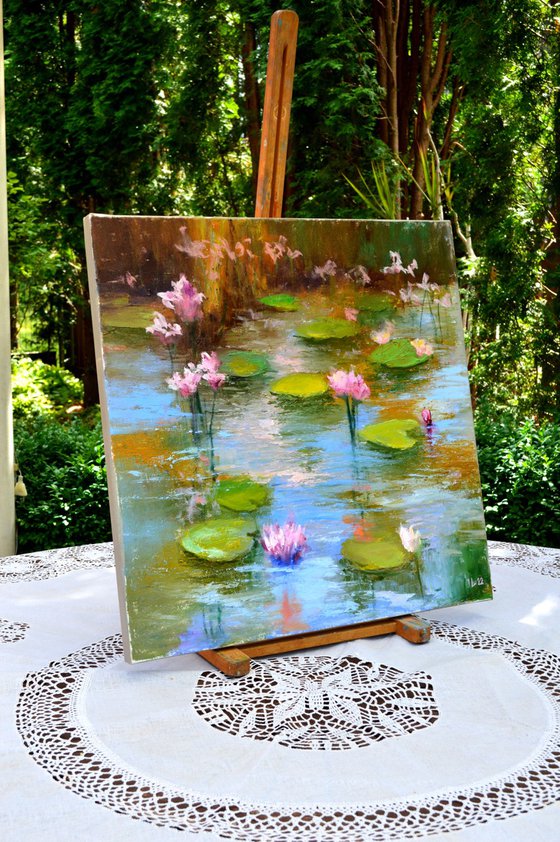 Pond with pink lilies