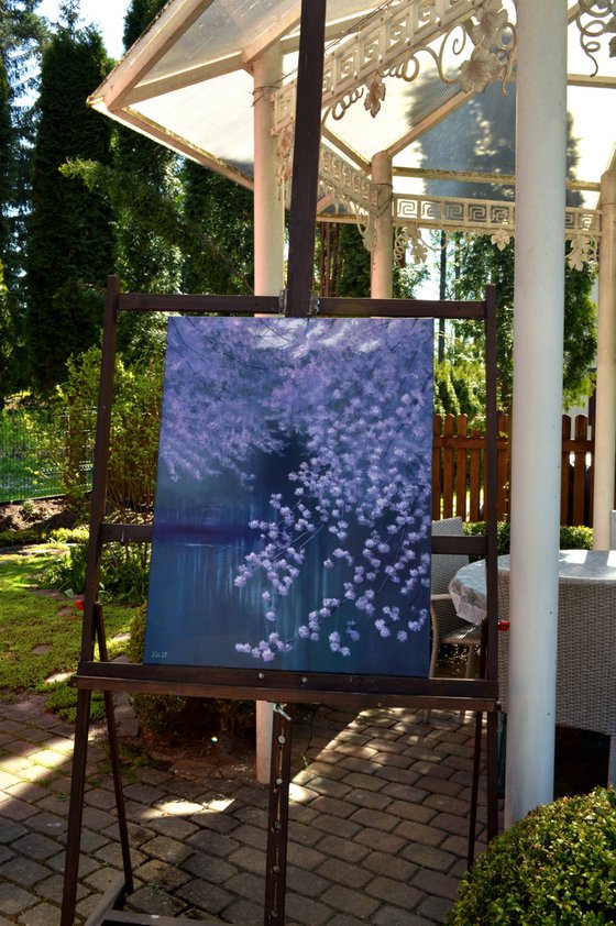 Blooming garden by the pond