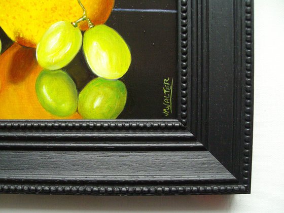 Orange with three grapes