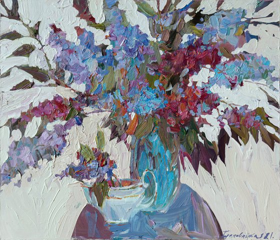 Lilac branches in a blue