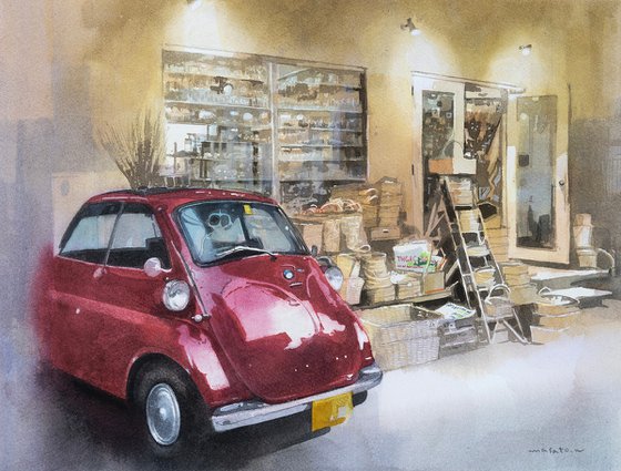 Red Vintage Car in Front of a General Store