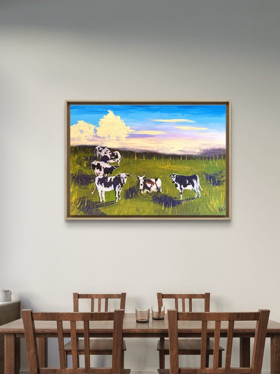 Cows grazing in the field