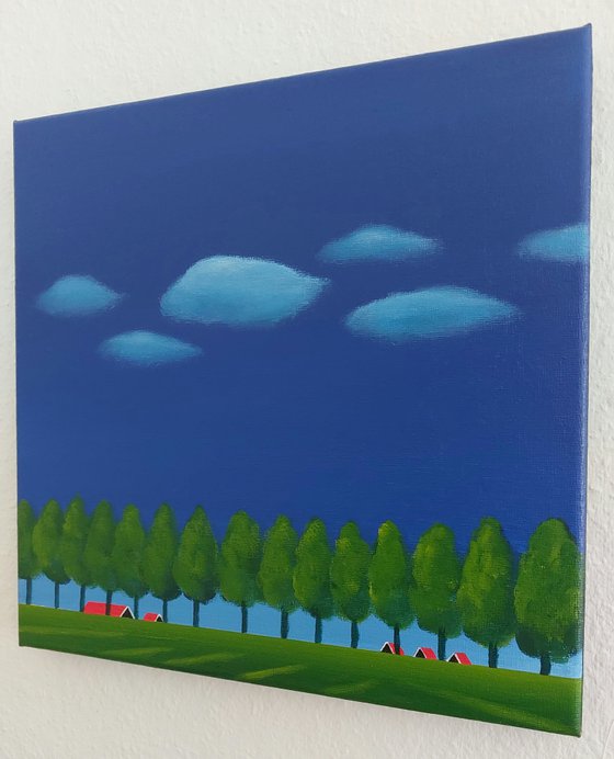 Dike with trees, floating clouds