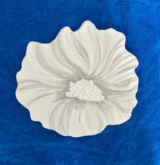 Small white sculptured  flower