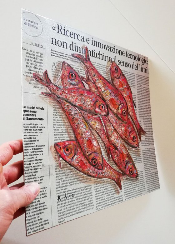 Red Fishes on Newspaper