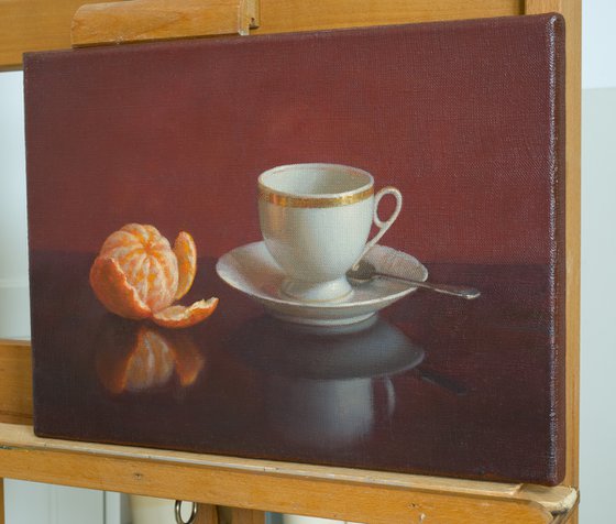 Cup of coffee and tangerine