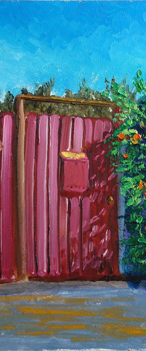 Red fence covered by flowers at the village street by Dmitry Fedorov