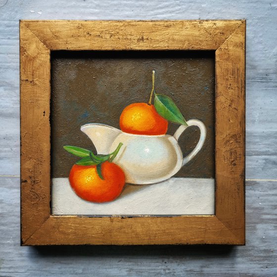 Oranges in Milk jug