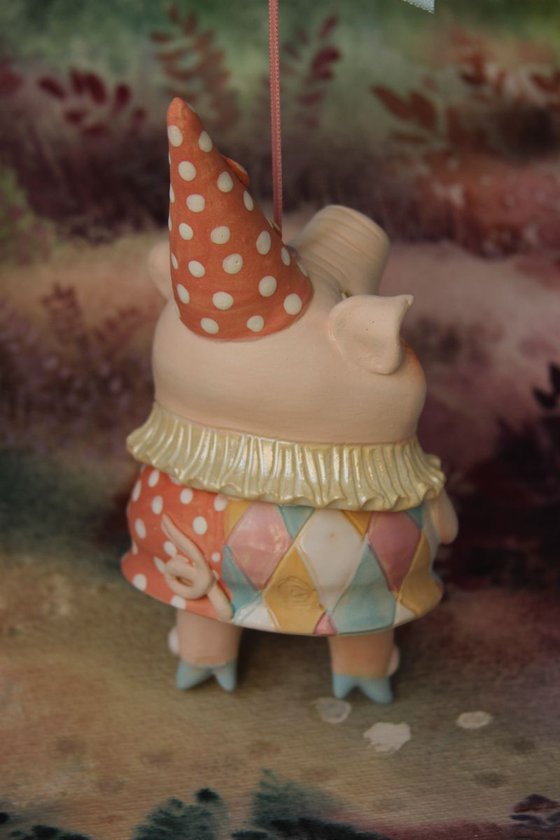 Little piggy in harlequin dress. Hanging sculpture, bell doll by Elya Yalonetski