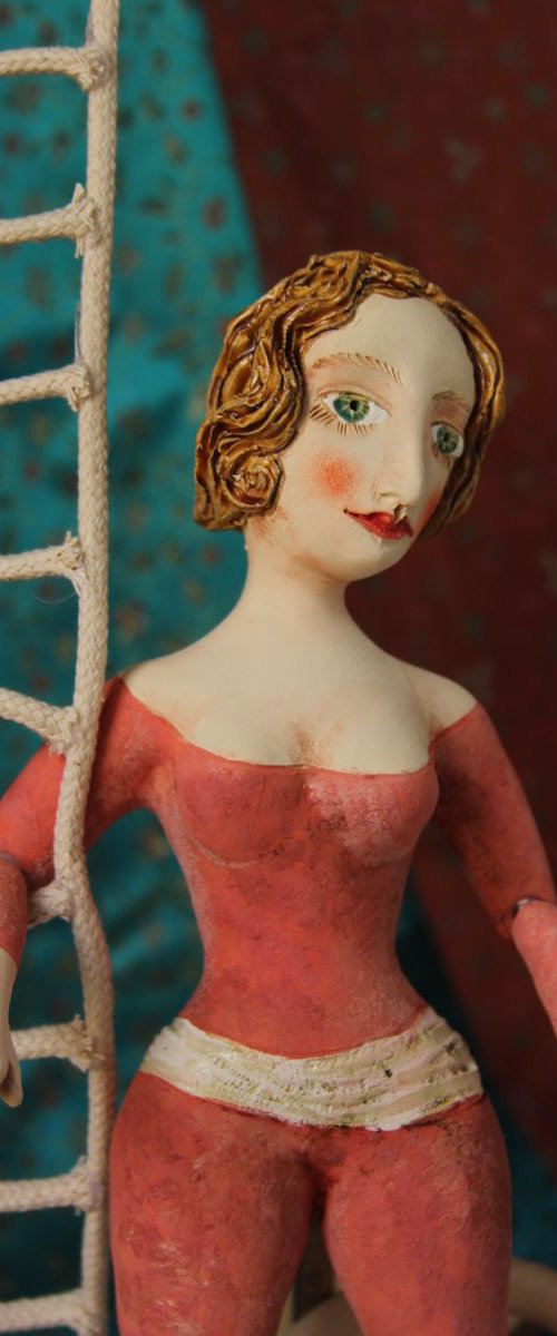 Agility, balance and beauty.  Acrobat in a red bodysuit. Wall sculpture by Elya Yalonetski. by Elya Yalonetski