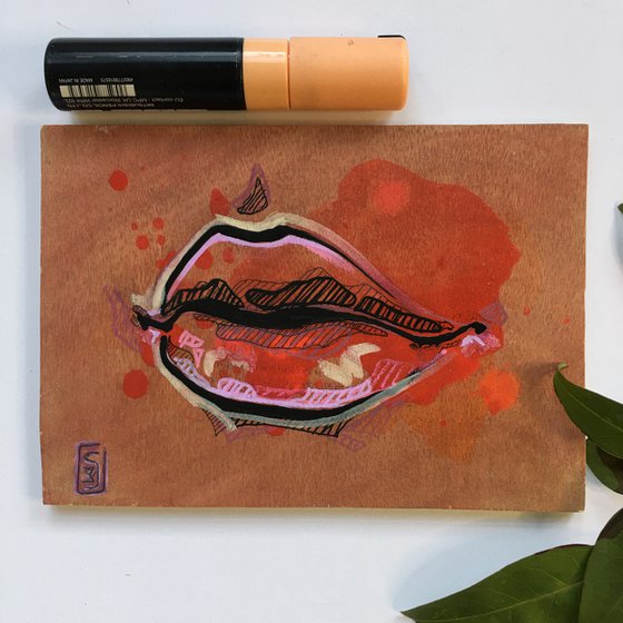 Pink lips on wood