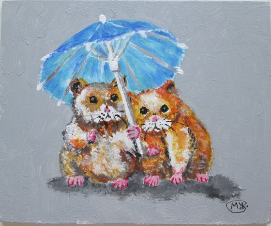 Lovely Hamsters together under a parasol