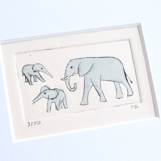 Small framed elephant and two young above and below