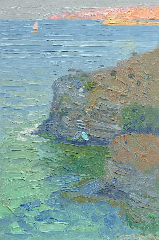 A lonely white sail gleams