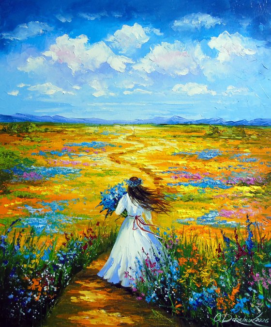Woman Walking Through a Flower Field