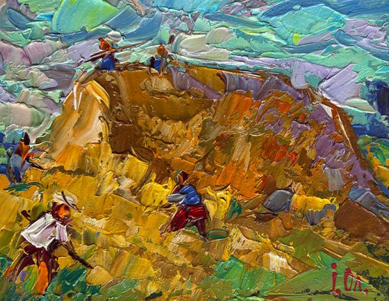 Working in the field with hay