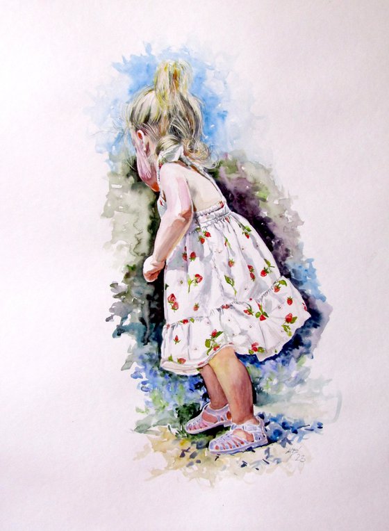 Little girl picking flowers