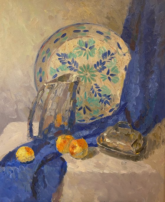 Still life with silver jug and blue drapery
