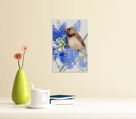 zebrafinch and blue flowers