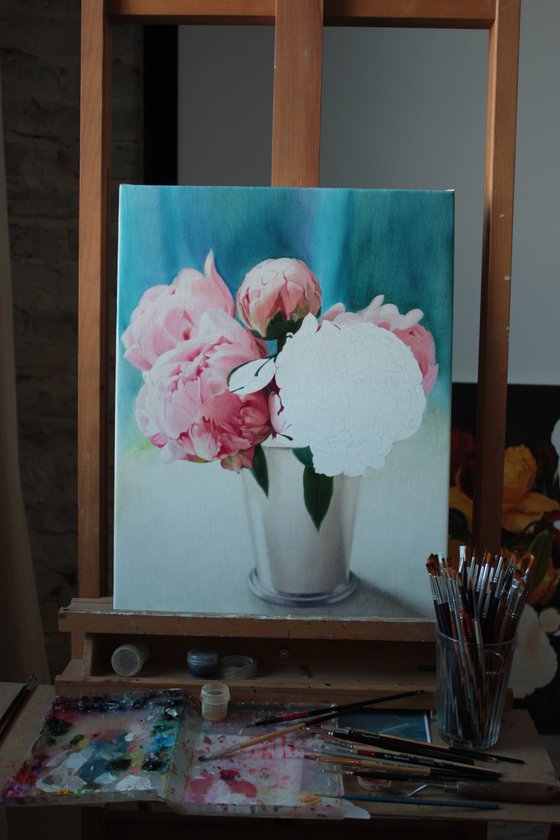 Bouquet of pink peonies on a blue background