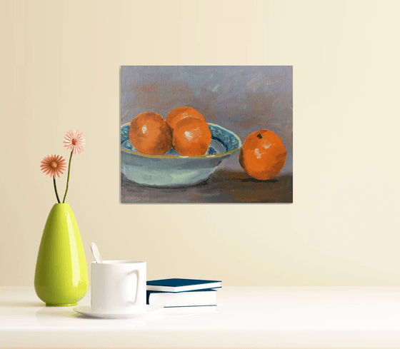 Oranges in a blue bowl. An original still life painting