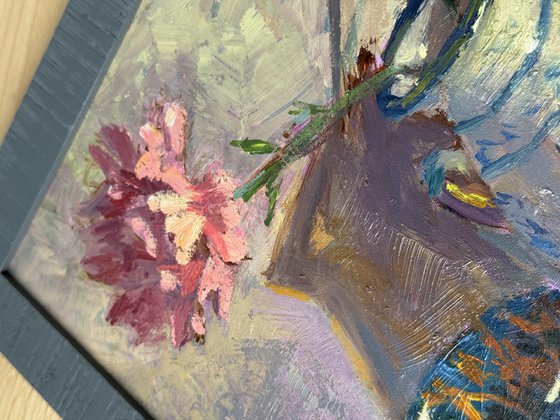 Lemons and flowers with a vase