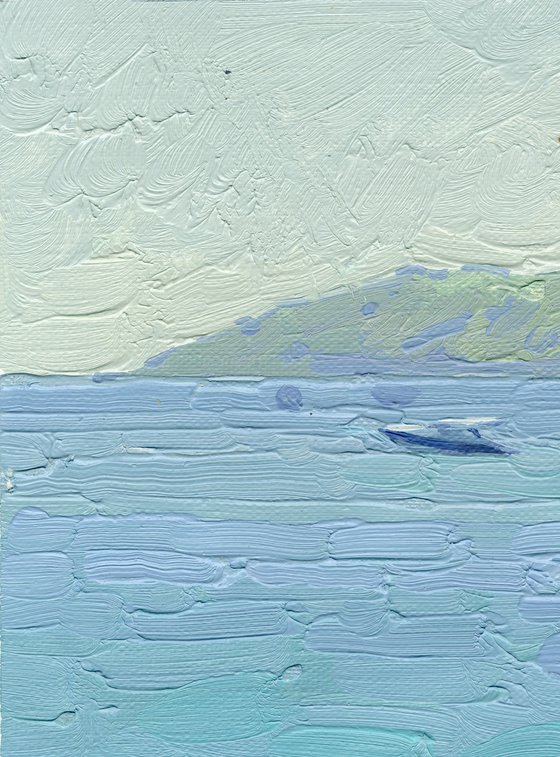 Yachts and umbrellas on the beach