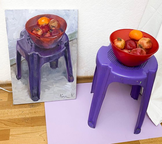 Tangerine on plastic chair