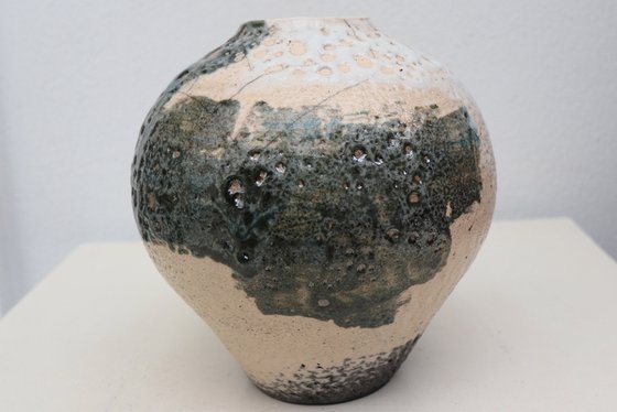 Raku and black smoked vessel.