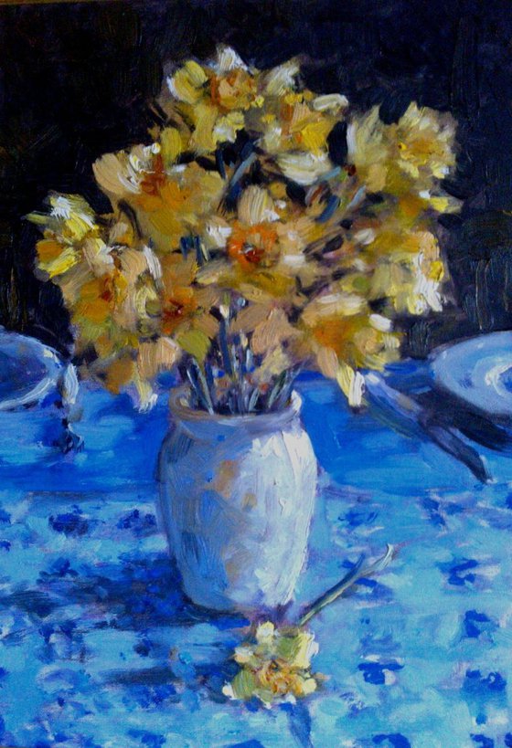 still life with flowers on blue background