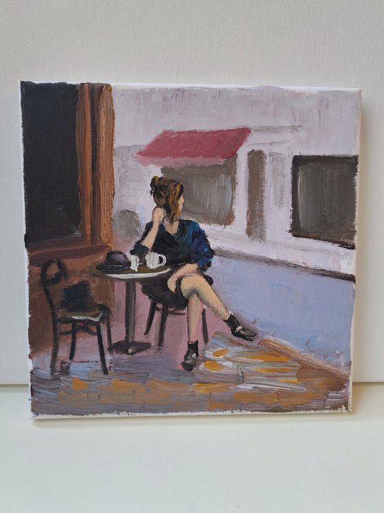 A woman in French cafe