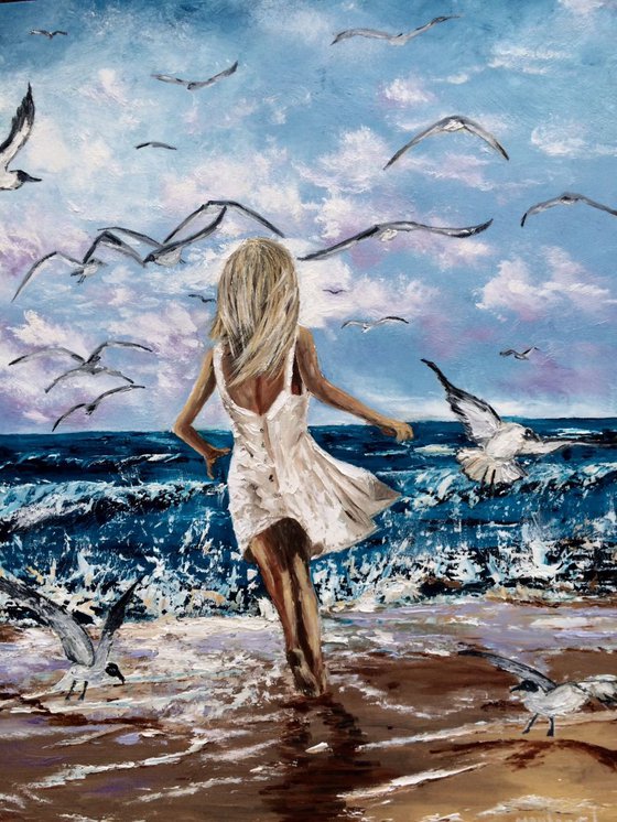 Girl chasing a seagulls