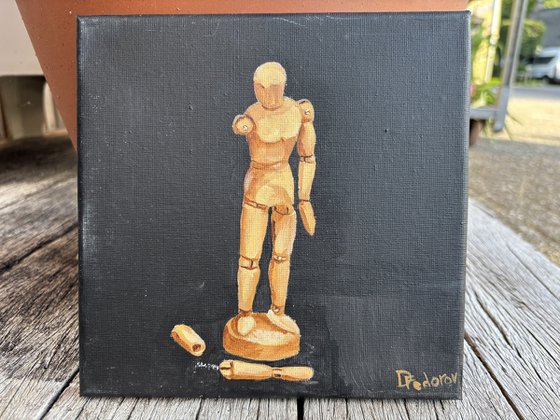Still life with wooden figure