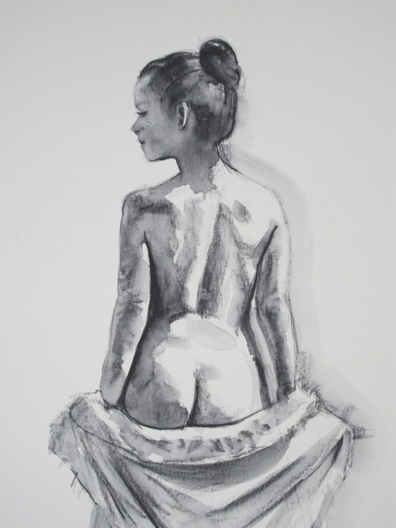 Standing female nude back view