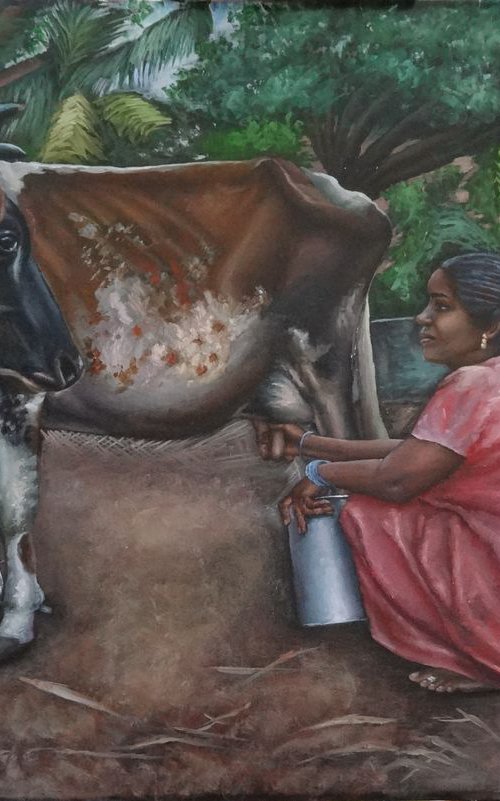 Woman milking the cow by Ramya Sadasivam