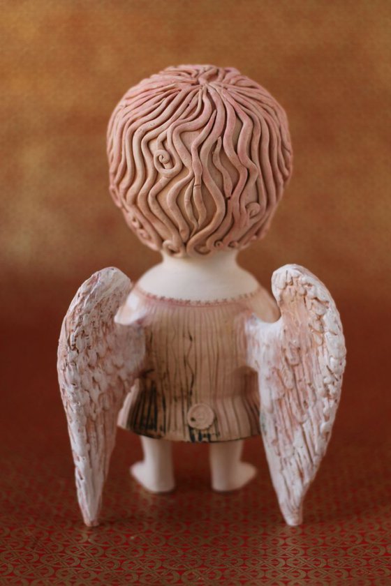 Angel holding a key. Ceramic OOAK sculpture by Elya Yalonetski