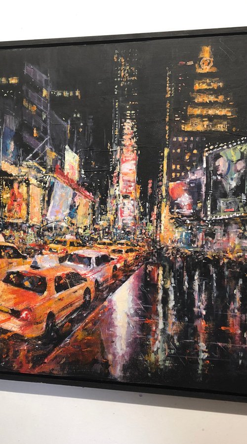 Times Square at night by Ewen Macaulay